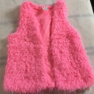 Bright pink vest for little girl.